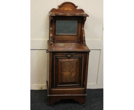An Edwardian inlaid mahogany coal purdonium with gallery top and mirror back, on shaped bracket base and castors, 40cm
