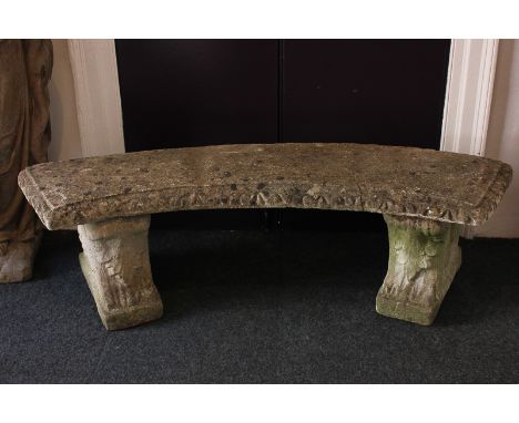 A composition stone garden bench with curved seat, on two pedestals, 150cm