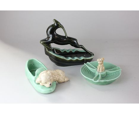 A Zsolnay Art Deco ceramic ashtray with leaping deer, 19cm, a Sylvac ashtray with puppy, and a puppy and shoe ornament