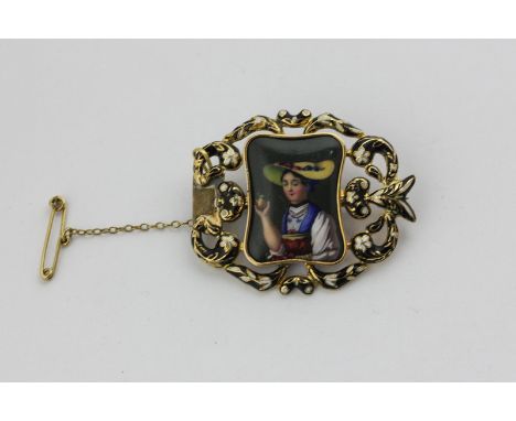 A Swiss enamel brooch, the plaque painted with a lady within a leaf scroll black and white enamel frame