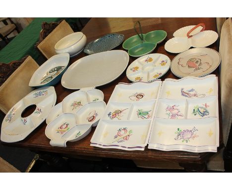 Seven Poole Pottery hors d'oeuvre dishes in twin-tone, vegetable and crustacean design, together with an oven-to-tableware ch