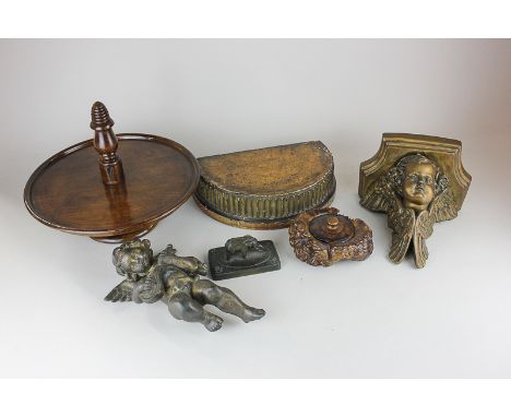 A gilt cherub wall mount, a spelter model of a cherub playing a lyre, a mahogany lazy susan, a carved wood box, a bronze elep