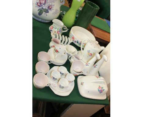 A Poole Pottery matched part breakfast set with six coffee cups and saucers, coffee pot, toast rack, butter dish, four egg cu