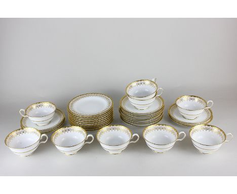 A Spode porcelain part tea set with gilt border, comprising eleven plates, ten saucers and nine teacups