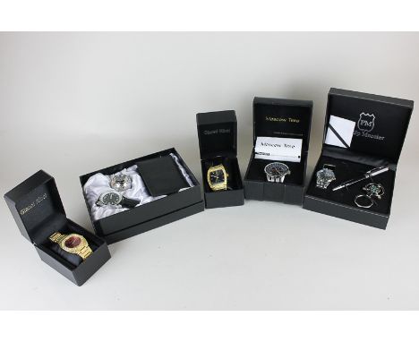 A Philip Mercier boxed watch set with pen and compass key ring, an Equinox boxed watch with football shaped clock and black w