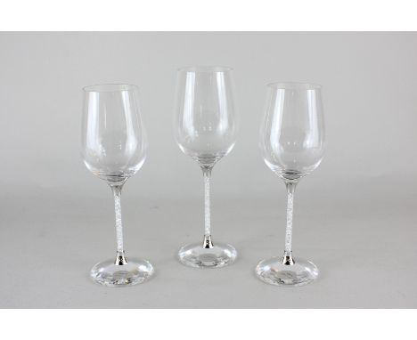 A pair of Swarovski white wine glasses with crystal filled stem, with a matching red wine glass