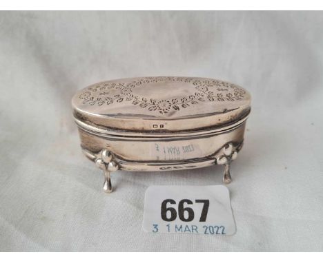 An oval ring box engraved with foliage and pad feet, 2 3/4" wide, Birmingham 1905