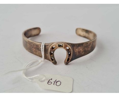 A silver horseshoe bangle - 27 g.