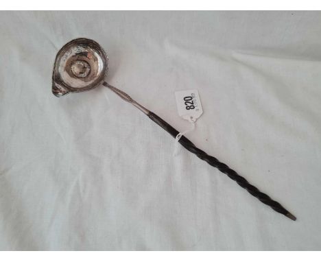 An 18th Century toddy ladle with Queen Anne shillings - 1711 