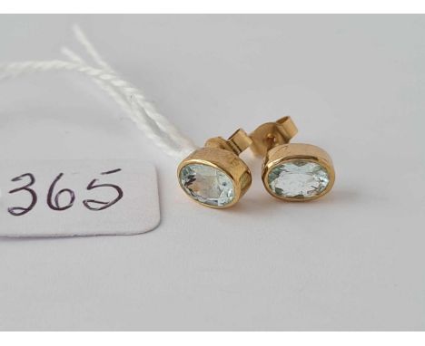 A pair of light blue ear studs 9ct