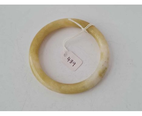 A polished hardstone bangle