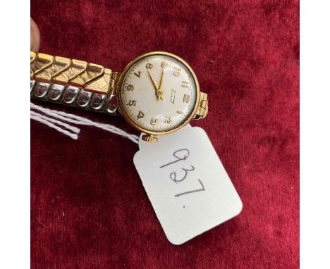 A ladies Tissot wrist watch 9ct with metal expandable strap 