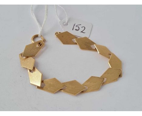 An Art Deco eleven panel chevron design bracelet, each link is individually hallmarked to gold bolt clasp - 9 g.