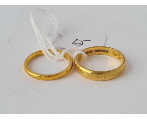One wide and one slim 22ct wedding bands - size M and J - 6.7 g.