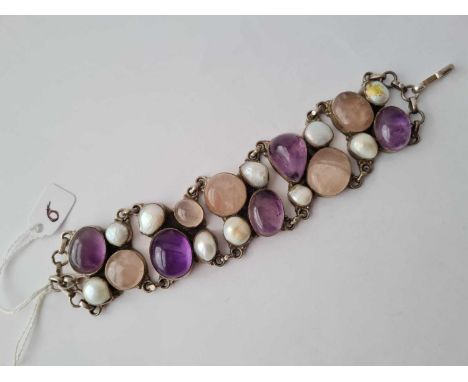 A five panelled attractive silver bracelet, each panel is set with cabochon stone and MOP 