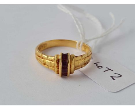 A high carat gold ring set with four baguette cut rubies - size N - 3.6 g.