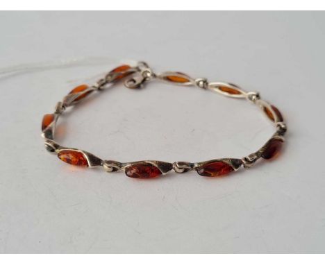 A silver and amber ten panel bracelet 