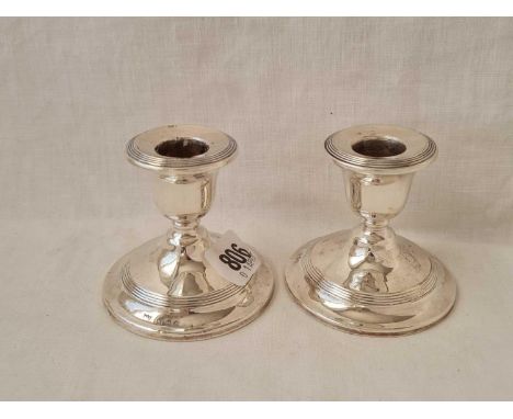 A smaller pair of candlestick with reeded rims - 3" high - Birmingham 1917 