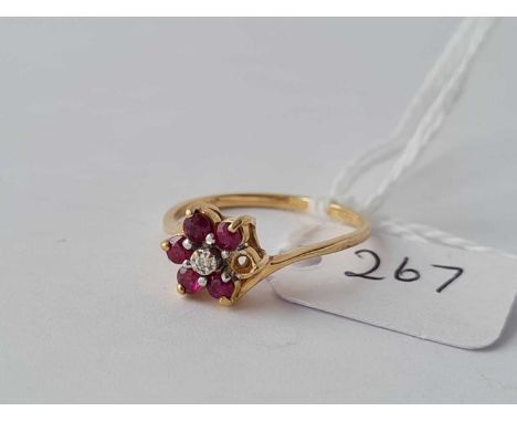 A ruby flower head ring (stone out) in 10ct size M 1.6g