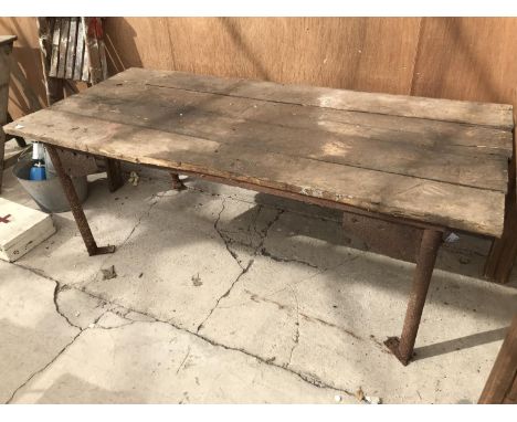 A VINTAGE WOODEN TOP TABLE ON INDUSTRIAL SUPPORTS 184CM X 81CM 