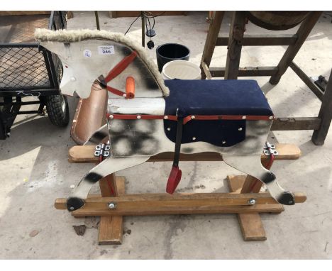 A WOODEN ROCKING HORSE 
