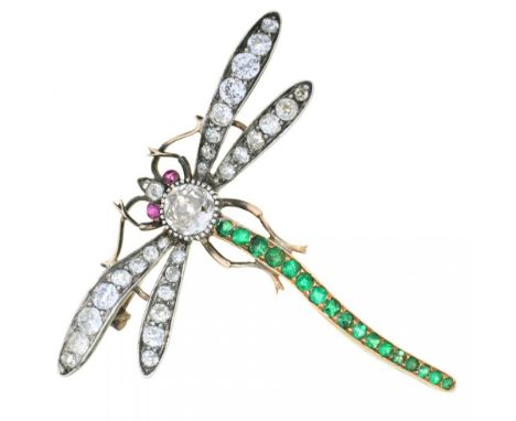 AN EDWARD VII DIAMOND AND EMERALD DRAGONFLY BROOCH, C1900  with ruby eyes, the collet SE set diamond to the abdomen approx 0.