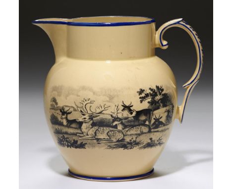 A STAFFORDSHIRE DRABWARE JUG, C1815 with bat prints of deer and hounds, gilt initials G J, the rims and handle in blue enamel