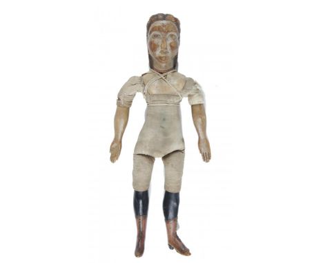 FOLK ART.  AN UNUSUAL CARVED AND PAINTED PINE DOLL, SECOND HALF 19TH C with waisted, padded body, the hair of the shoulder he