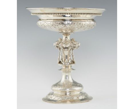 A VICTORIAN SILVER CENTREPIECE  the compressed bowl chased with  oak leaves and acorns, on spool stem with lion masks and swa