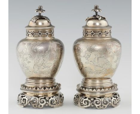 A PAIR OF EDWARD VII CHINOISERIE ENGRAVED SILVER JARS, COVERS AND STANDS IN WILLIAM AND MARY STYLE  the domed cover with flow