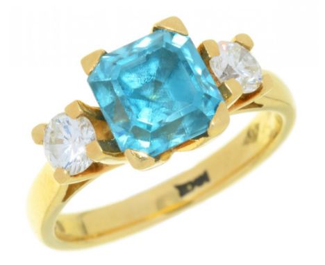 A BLUE ZIRCON AND DIAMOND RING the square zircon 2.5ct approx, the brilliant cut diamonds 0.4ct approx, in 18ct gold, London 