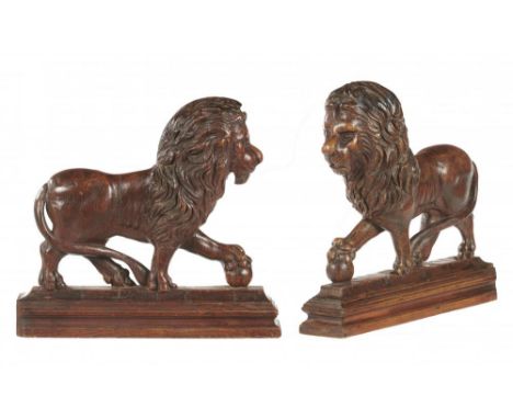 FOLK ART.  A PAIR OF UNUSUAL CARVED OAK MEDICI LIONS, PROBABLY BRITISH, 19TH C  on cavetto plinth, 35cm h++One or two minor o