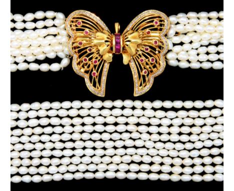 A MULTI STRAND PEARL NECKLACE WITH RUBY AND DIAMOND SET GOLD BUTTERFLY CLASP  84cm l, marked on clasp 750, 18k++In good condi
