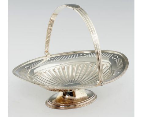 A GEORGE V NEO CLASSICAL STYLE PIERCED SILVER CAKE BASKET  with fluted swing handle, 23cm h, by Lee &amp; Wigfull Ltd, Sheffi