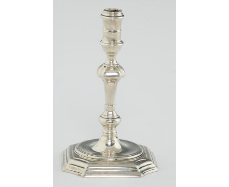 A GEORGE II SILVER TAPERSTICK  with banded sconce, on moulded foot,  engraved under the foot with contemporary initials O/R*E