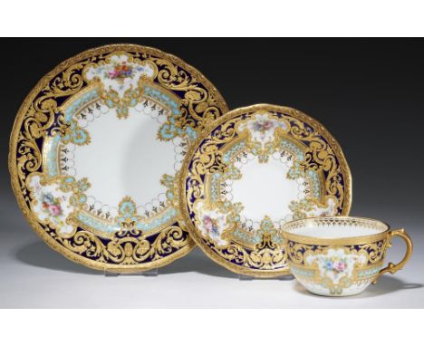 A ROYAL CROWN DERBY TEACUP, SAUCER AND PLATE FROM THE GARY SERVICE, 1909each piece painted by A Gregory with two or three gro