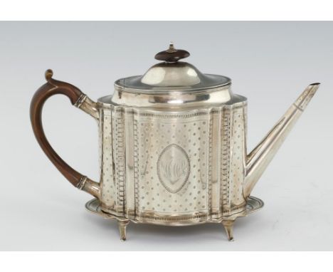 A GEORGE III BRIGHT CUT SILVER TEAPOT AND STAND straight sided and of serpentine form, the domed lid with integral hinge, 17c