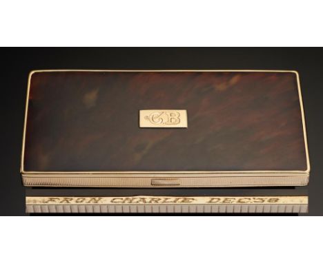CHARLIE CHAPLIN. A GOLD AND TORTOISESHELL CIGARETTE CASE, DATED 1938 rectangular with milled edge and sliding catch,  the lid