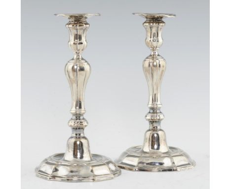 A PAIR OF AUSTRIAN NETHERLANDS SILVER CANDLESTICKS with inverted baluster knopped pillar, waisted sconce and  moulded foot, n