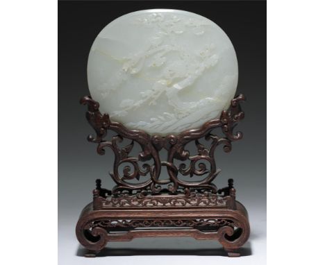 A CHINESE WHITE JADE PLAQUE, QING DYNASTY, 19TH  C  of slightly convex form carved with phoenix and prunus, 13cm l, wood stan