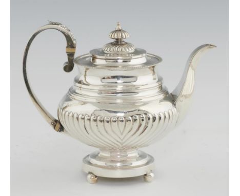 A GEORGE IV SILVER TEAPOT spirally reeded, crested, 21cm h, by John Edward Terrey, London 1821, 23ozs 12dwts++Light wear and 