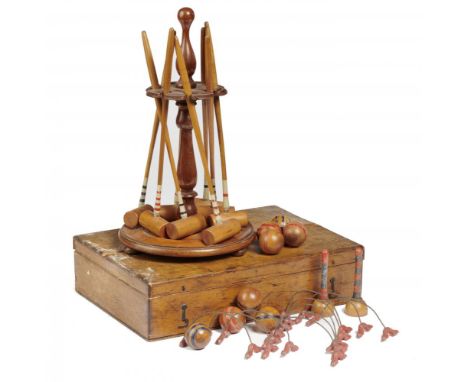 A VICTORIAN TABLE CROQUET GAME, LATE 19TH  C  of eight light wood mallets, hoops, balls and turned stand, in varnished deal b