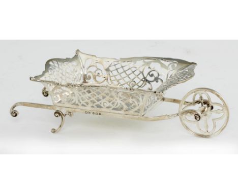 AN EDWARD VII WHEELBARROW NOVELTY SILVER SWEETMEAT BASKET with flared and pierced sides, 21cm l, by Henry Matthews, Birmingha