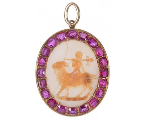 A CHALCEDONY CAMEO OF A FAUN ON A GOAT, 18TH/19TH C   set in a later gold pendant with ruby surround, 4.6cm excluding loop++C