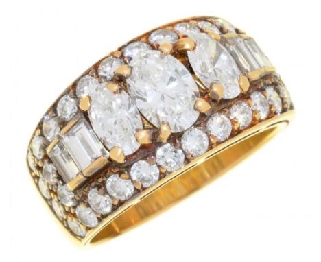 A DIAMOND TROMBINO RING BY BULGARI  the oval, baguette and brilliant cut diamonds  3ct approx, G colour, VS clarity, in gold 