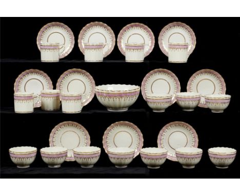 A PINXTON FLUTED TEA AND COFFEE SERVICE, 1796-1813 with pink and gilt band , slop basin 15cm diam (29)Provenance: Mary Anne J