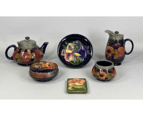 COLLECTION OF MOORCROFT POTTERY including pomegranate pattern circular squat teapot, hot water jug and sugar basin, hammered 