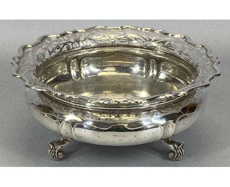 CIRCULAR SILVER FRUIT BOWL with flared, pierced and shaped upper rim, squat form body on three knurled shell form feet, Sheff
