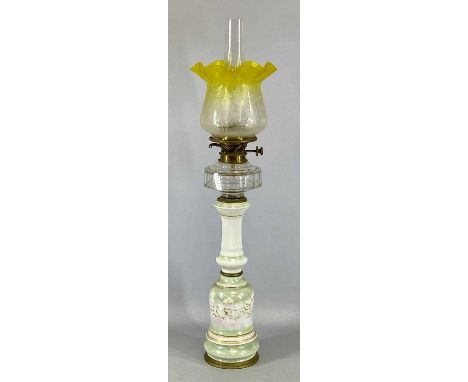 A VICTORIAN OIL LAMP having slender lustre glazed ceramic column, faceted clear cut glass reservoir, duplex single burner, et