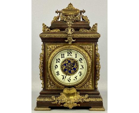 A FRENCH OAK & GILDED ORMOLU MANTEL CLOCK, late 19th century, cream ceramic dial with black Arabic numerals, pierced to the c